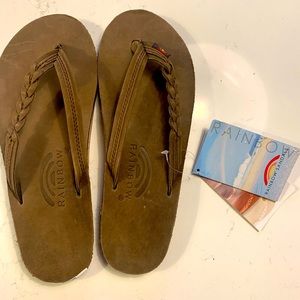 Brand new rainbow flip flops, with tags and stickers